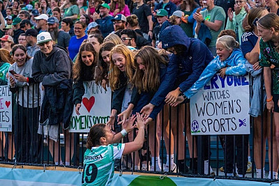 Menlo alum Carolina Espinosa greets fans at the sold-out women's exhibition match for Vermont Green FC in late June.